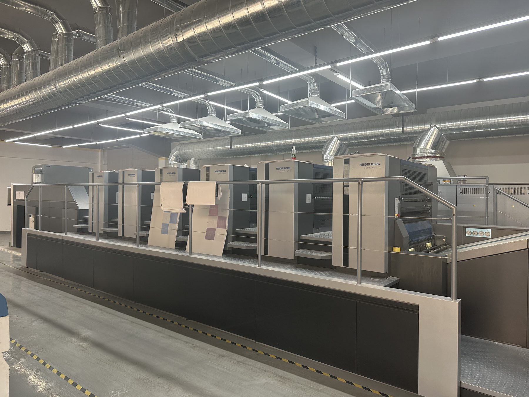 Printing press line for custom paper packaging